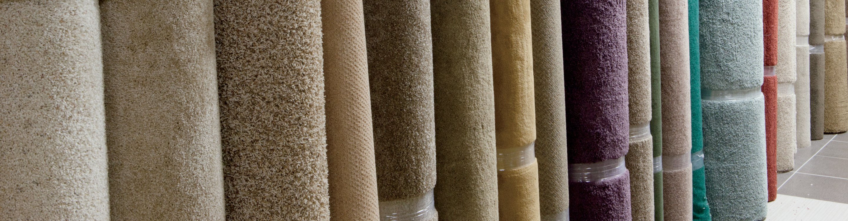 Colorful rolls of carpet flooring. 